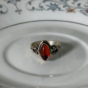925 Sterling silver women’s ring size 7 with garnet color center stone